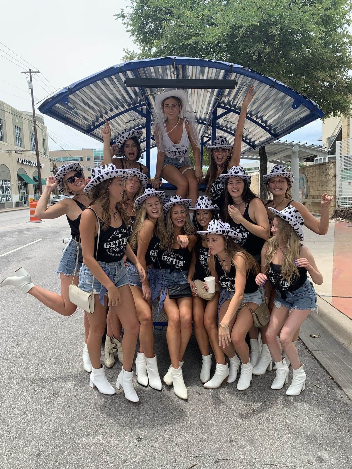 Big bachelorette group cheering by the bike
