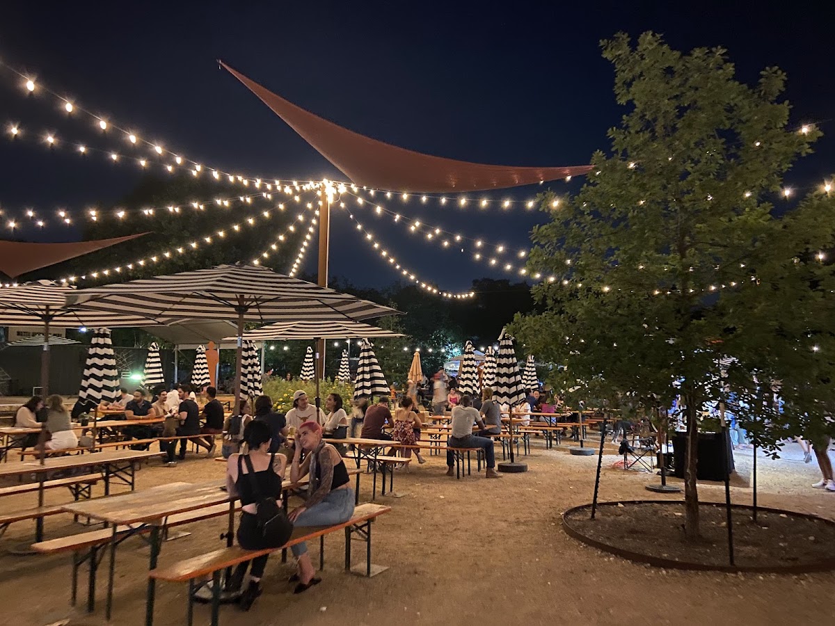 String lights over the large outdoor beer garden at Central Machine Works brewery in East Austin