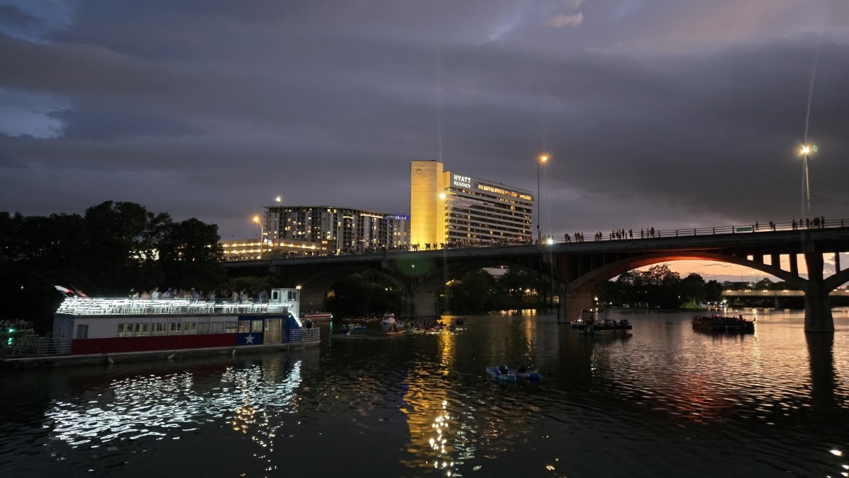 The Ann W. Richards Congress Avenue Bridge over Lady Bird Lake in Austin at dusk, the bat-viewing hour