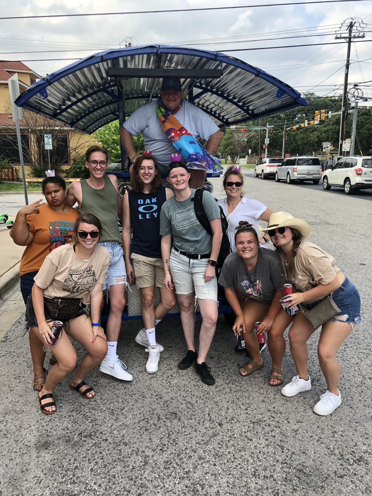 A mixed group of coworkers with the Austin Bar Bike before a weekday ride