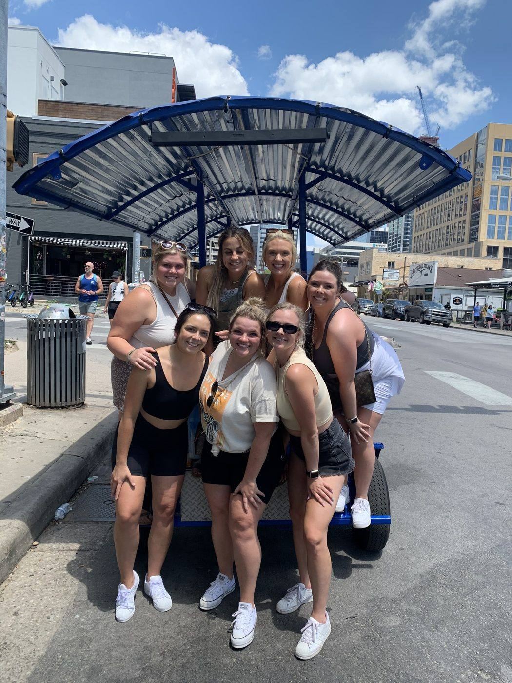 A big group having a blast on the party bike