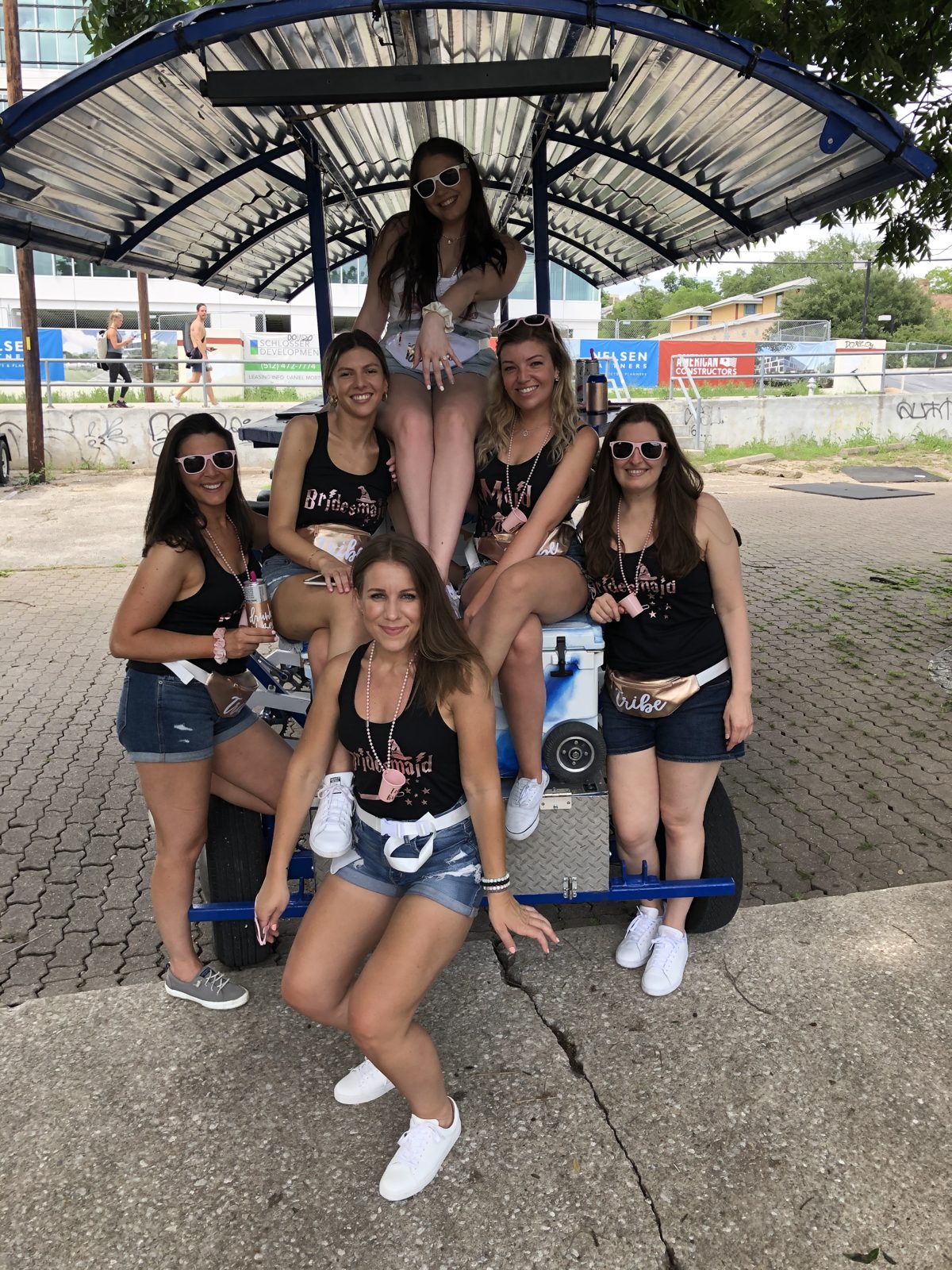A group of friends on the deck of the 15-seat Austin Bar Bike during a girls trip ride