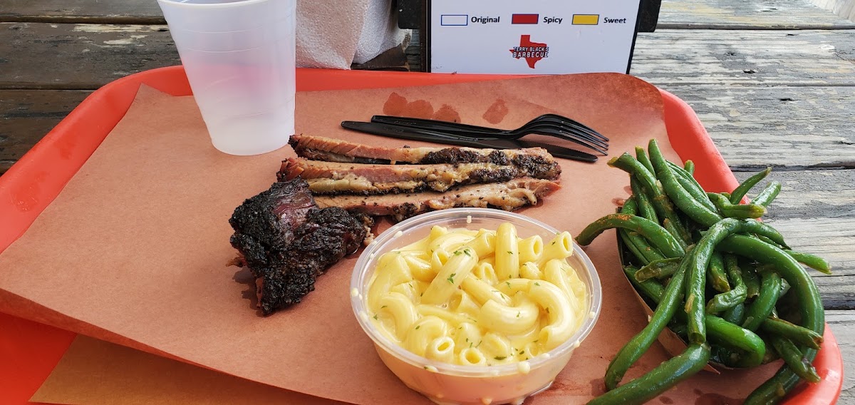 A butcher paper tray of Central Texas brisket, ribs and sausage sized for a large group