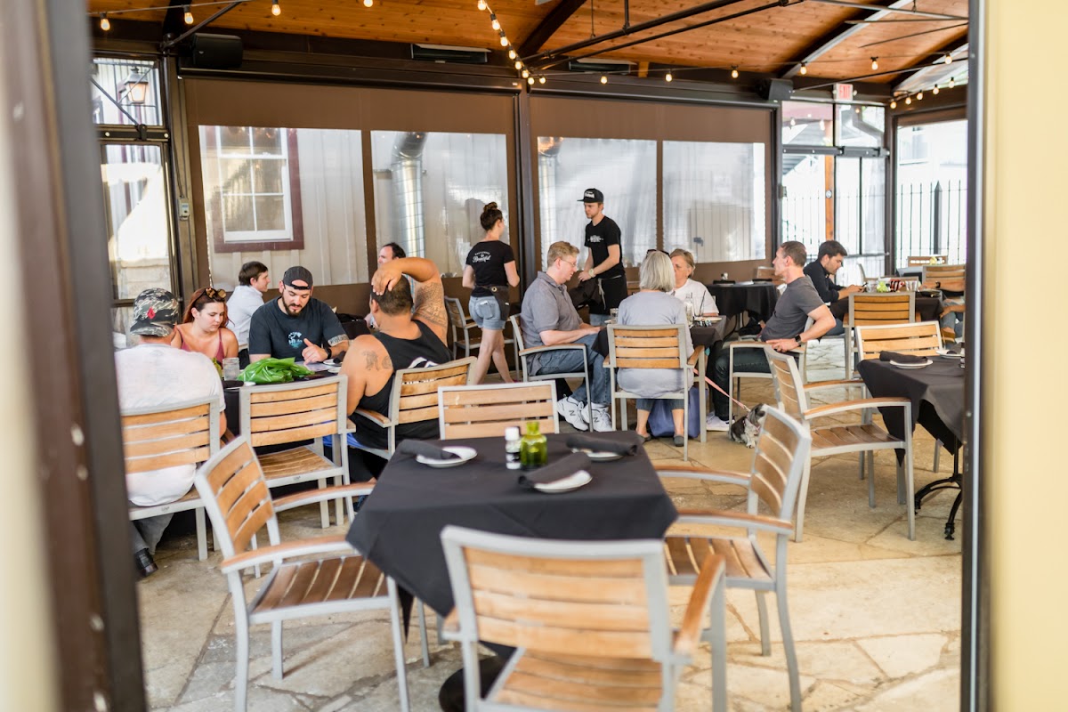 The historic 1850s stone building and patio at Moonshine Grill on Red River Street in downtown Austin