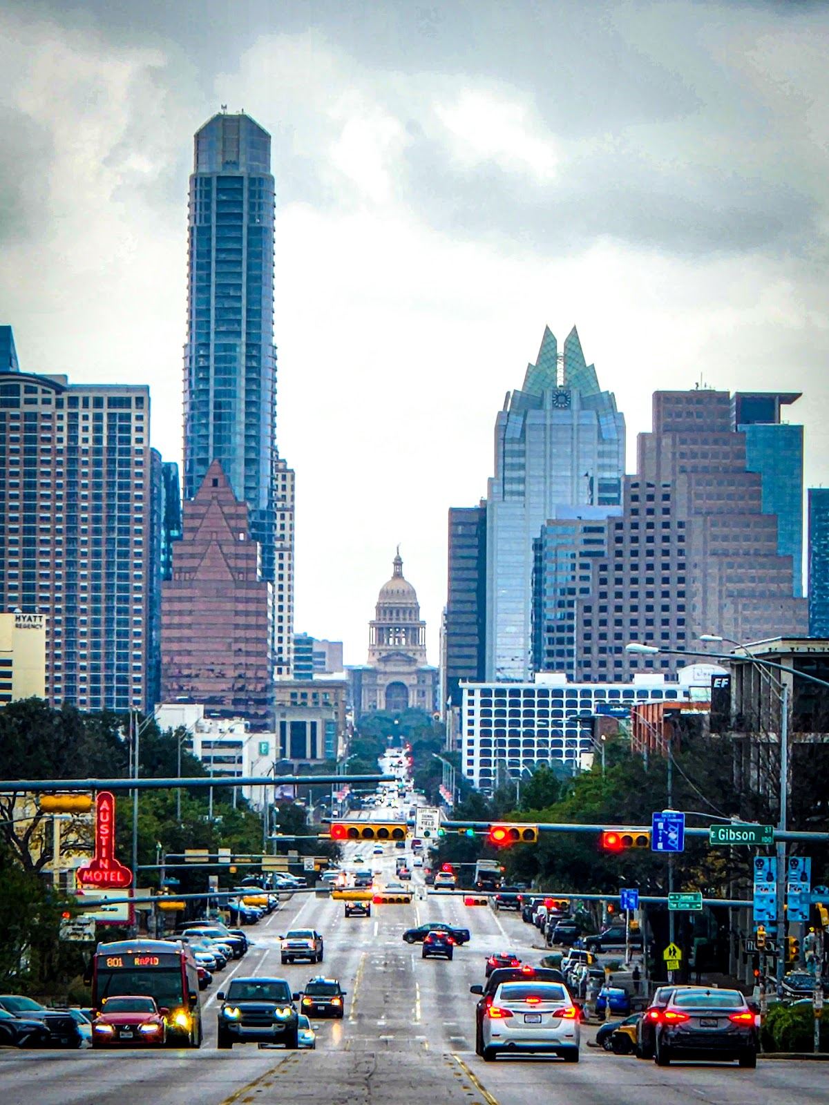 Shops, neon signs and the downtown skyline view looking north up South Congress Avenue in Austin
